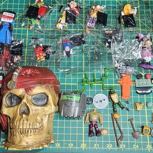 Assorted Action Figures and Skull Decor